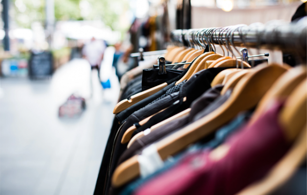 clothes hanging on retail rack